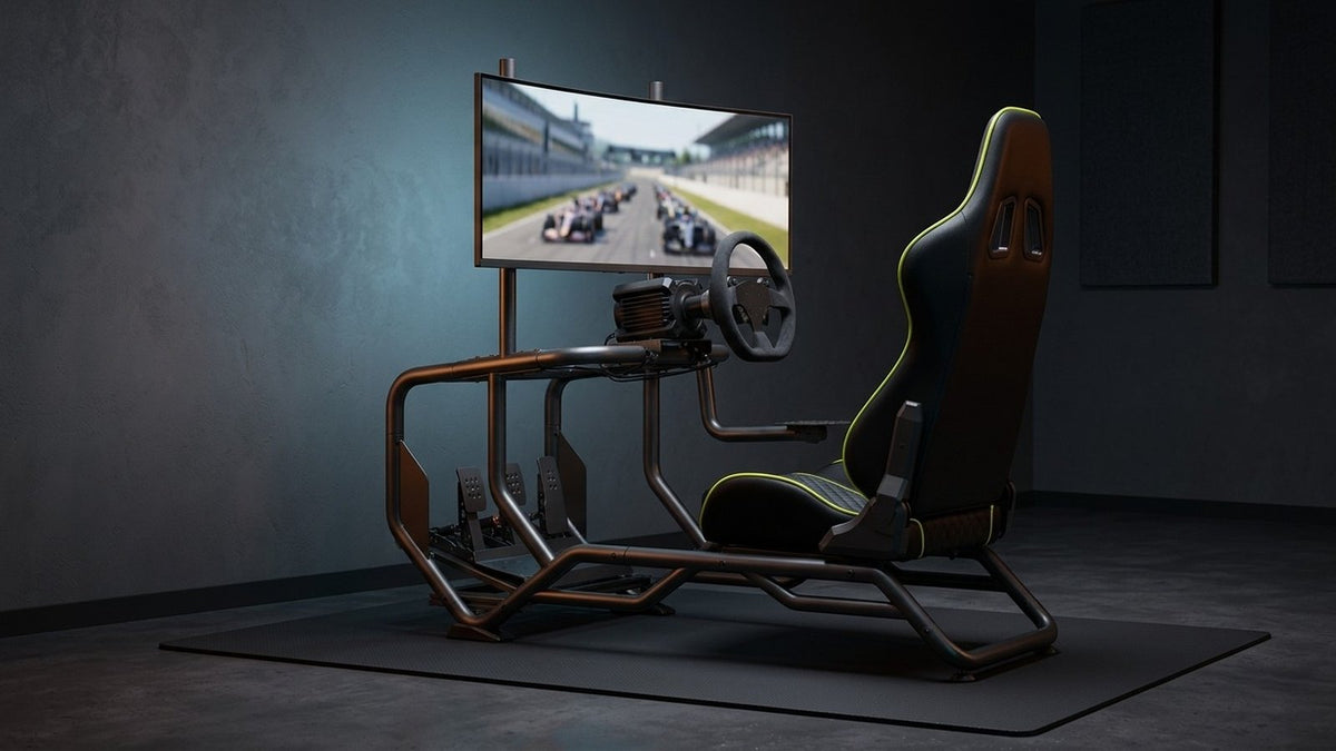Playmax Velocity racing sim cockpit with racing wheel, pedals and monitor mount in a dark gaming room